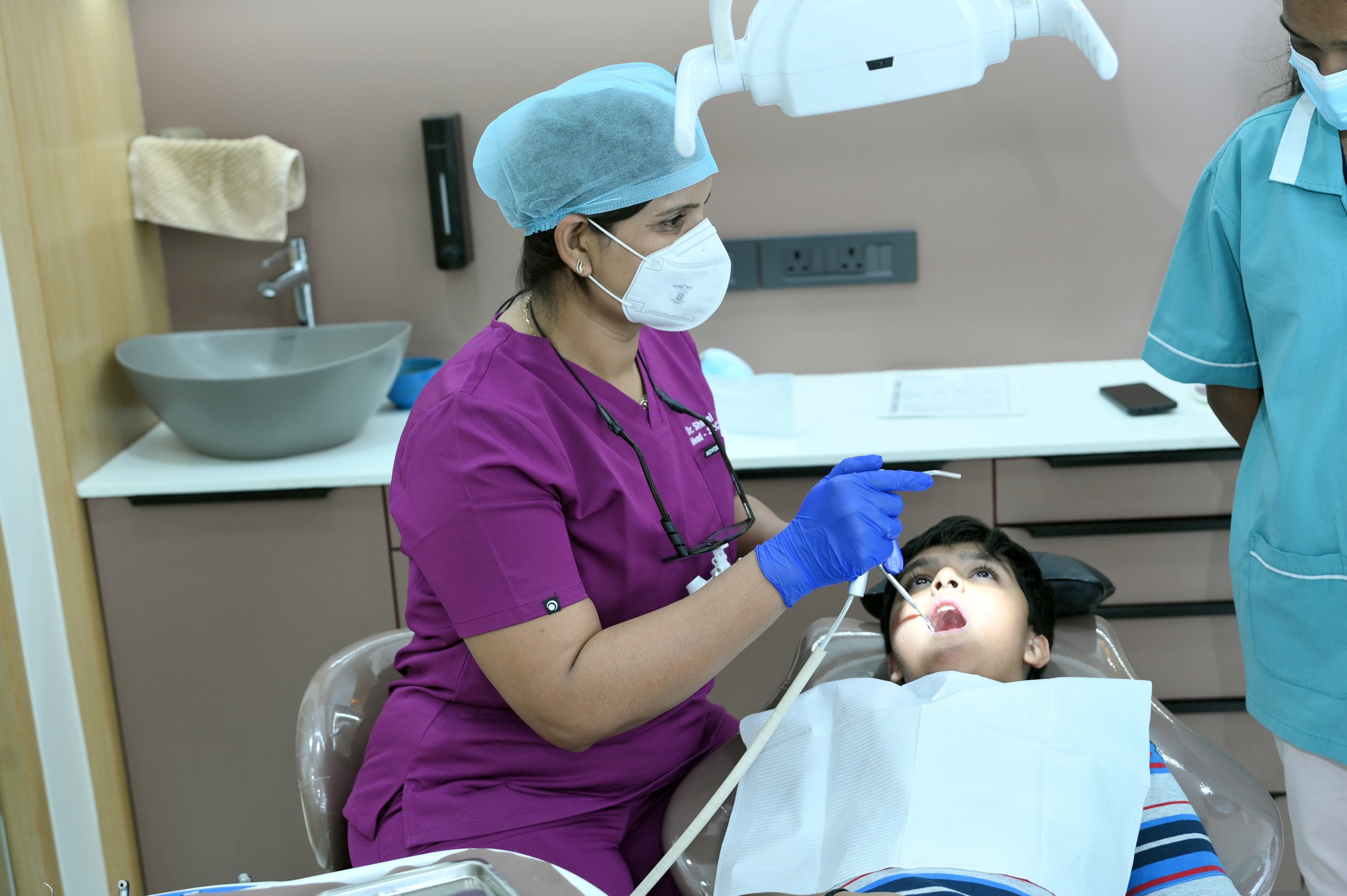 Dentist welcoming a patient at the dental clinic
